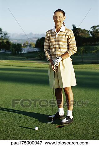 Mature woman playing golf, portrait View Large Photo Image Stock Photo - Mature woman playing golf, portrait. Fotosearch