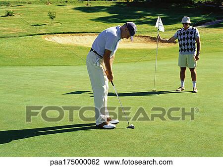 Two mature men playing golf View Large Photo Image Stock Image - Two mature men playing golf. Fotosearch