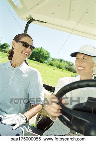 Two mature women in golf cart, close-up View Large Photo Image Stock Photography - Two mature women in golf cart, close-up. Fotosearch