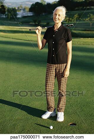 Woman playing golf, portrait View Large Photo Image Stock Image - Woman playing golf, portrait. Fotosearch
