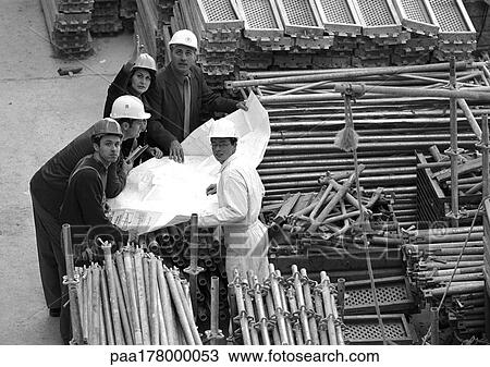 Five people examining blueprints in construction site, portrait, b&w View Large Photo Image Stock Image - Five people examining blueprints in construction site, portrait, b&w. Fotosearch