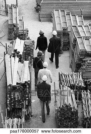 Five people in construction site, elevated view, b&w View Large Photo Image Stock Photo - Five people in construction site, elevated view, b&w. Fotosearch