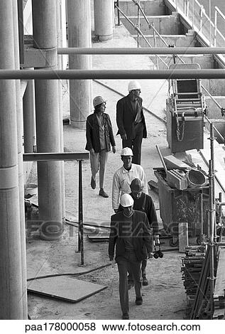 Five people in construction site, elevated view, b&w View Large Photo Image Stock Photo - Five people in construction site, elevated view, b&w. Fotosearch
