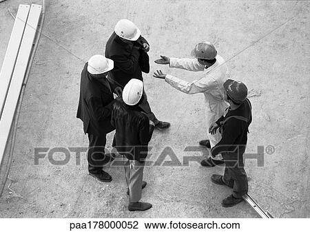 Five people wearing hard hats, elevated view, full length View Large Photo Image Stock Image - Five people wearing hard hats, elevated view, full length. Fotosearch