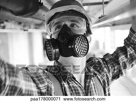 Man wearing hard hat, dust mask and protective glasses, close-up, b&w View Large Photo Image Stock Image - Man wearing hard hat, dust mask and protective glasses, close-up, b&w. Fotosearch