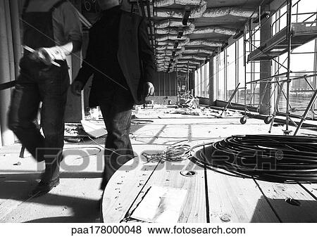 People in construction site, low section, b&w View Large Photo Image Stock Photo - People in construction site, low section, b&w. Fotosearch