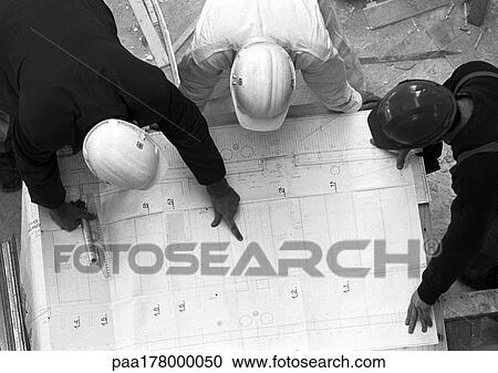 Three people with hard hats, examining blueprint, elevated view, b&w View Large Photo Image Stock Image - Three people with hard hats, examining blueprint, elevated view, b&w. Fotosearch