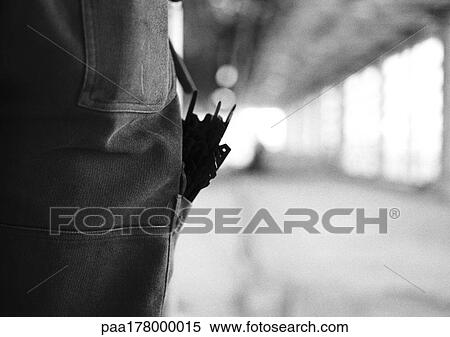 Tools sticking out of pocket, close-up, b&w View Large Photo Image Stock Photography - Tools sticking out of pocket, close-up, b&w. Fotosearch