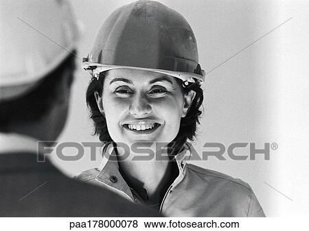 pictures of woman wearing hard hat smiling close up b w