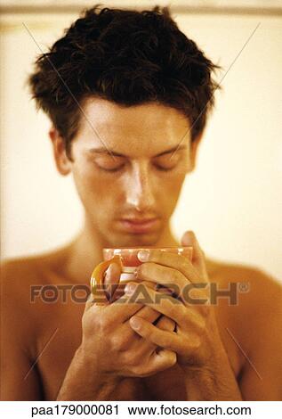 Bare-chested man holding mug View Large Photo Image Stock Image - Bare-chested man holding mug. Fotosearch