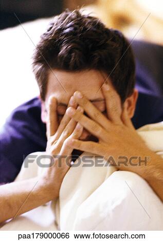 Man covering face, close-up View Large Photo Image Stock Photograph - Man covering face, close-up. Fotosearch