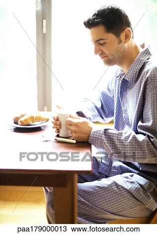 Man having breakfast View Large Photo Image Stock Image - Man having breakfast. Fotosearch