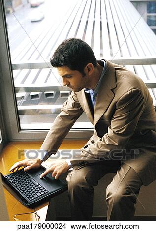 Man using laptop computer View Large Photo Image Picture - Man using laptop computer. Fotosearch