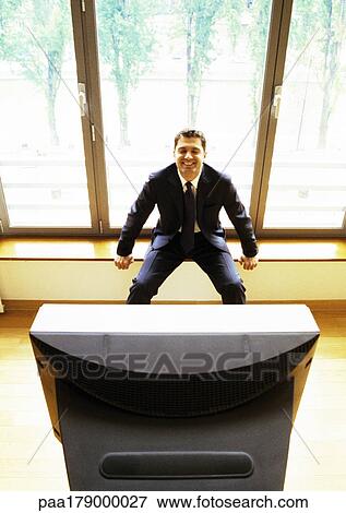 Man watching television View Large Photo Image Stock Photo - Man watching television. Fotosearch