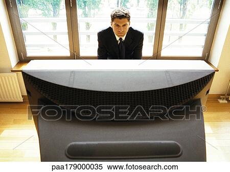 Man watching television View Large Photo Image Stock Photography - Man watching television. Fotosearch
