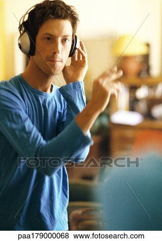 Man wearing headphones View Large Photo Image Stock Photo - Man wearing headphones. Fotosearch
