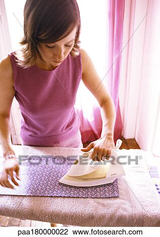 Woman doing ironing View Large Photo Image Stock Image - Woman doing ironing. Fotosearch
