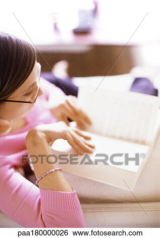 Woman reading book, side view View Large Photo Image Stock Photograph - Woman reading book, side view. Fotosearch