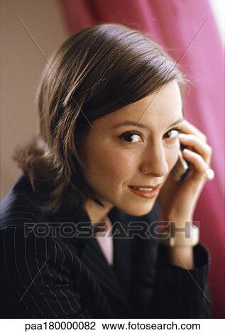 Woman with cell phone, close-up, portrait View Large Photo Image Stock Image - Woman with cell phone, close-up, portrait. Fotosearch