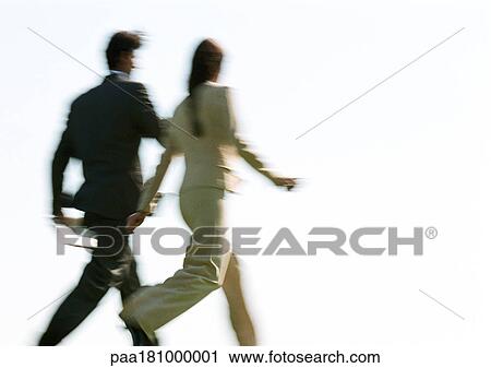 Businessman and woman walking, rear view, blurred View Large Photo Image Stock Image - Businessman and woman walking, rear view, blurred. Fotosearch