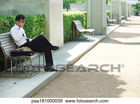 Businessman on bench View Large Photo Image Stock Photo - Businessman on bench. Fotosearch
