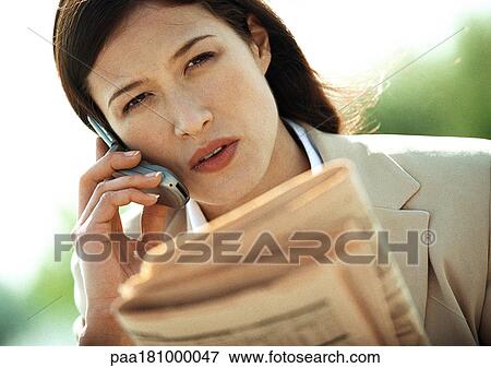 Businesswoman using cell phone, close-up, tilt View Large Photo Image Stock Photo - Businesswoman using cell phone, close-up, tilt. Fotosearch