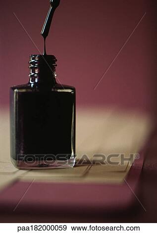 Stock Photo - Bottle of black nail polish, close-up. Fotosearch