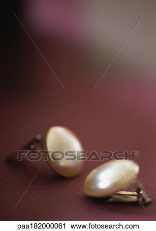 Stock Image - Clip-on earrings, close-up. Fotosearch