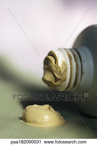 Dab of beauty product and tip of bottle, close-up View Large Photo Image Stock Image - Dab of beauty product and tip of bottle, close-up. Fotosearch