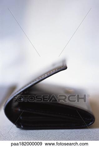 Stock Photo - Leather wallet, close-up, blurred. Fotosearch