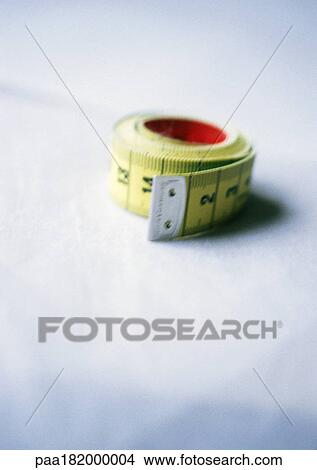 Measuring tape, close-up, blurred View Large Photo Image Picture - Measuring tape, close-up, blurred. Fotosearch