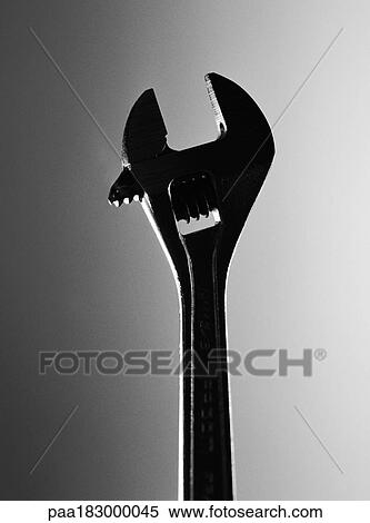 Stock Photography - Adjustable wrench, close-up, b&w. Fotosearch