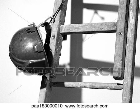 Hard hat tied to ladder, close-up, b&w View Large Photo Image Stock Image - Hard hat tied to ladder, close-up, b&w. Fotosearch
