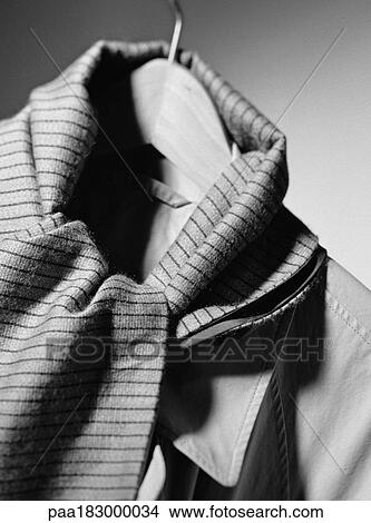 Picture - Jacket and scarf on coat hanger, close-up, b&w. Fotosearch