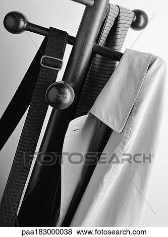 Jacket, bag and scarf on coat rack, close-up, b&w View Large Photo Image Stock Photo - Jacket, bag and scarf on coat rack, close-up, b&w. Fotosearch