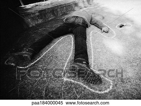 Stock Photography - Outline around man lying on ground, b&w. Fotosearch
