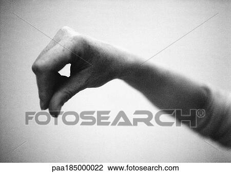 Stock Image - Hand, close-up, b&w. Fotosearch