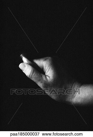 Stock Photo - Hand holding handle, close-up, b&w. Fotosearch