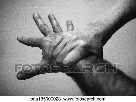 Hand holding wrist, close-up, b&w View Large Photo Image Stock Photo - Hand holding wrist, close-up, b&w. Fotosearch