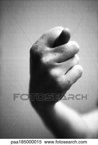 Stock Photography - Hand making obscene gesture, close-up, b&w. Fotosearch