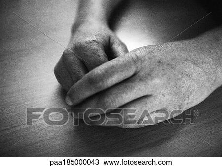 Stock Image - Hand together, close-up, b&w. Fotosearch