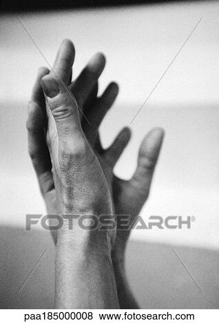 Stock Photo - Hands, close-up, b&w. Fotosearch