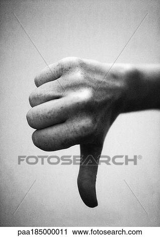 Thumb pointing down, close-up, b&w View Large Photo Image Stock Image - Thumb pointing down, close-up, b&w. Fotosearch