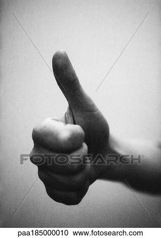 Thumb pointing up, close-up, b&w View Large Photo Image Stock Image - Thumb pointing up, close-up, b&w. Fotosearch