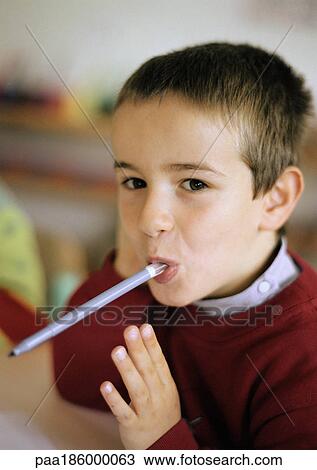 Child holding felt pen in mouth View Large Photo Image Stock Image - Child holding felt pen in mouth . Fotosearch