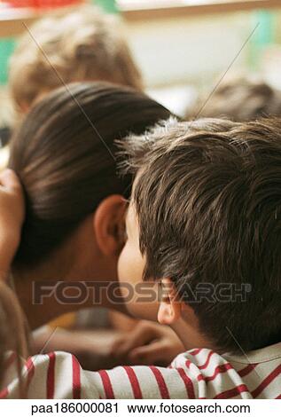 Child kissing person's cheek, close-up, rear view View Large Photo Image Stock Image - Child kissing person's cheek, close-up, rear view. Fotosearch
