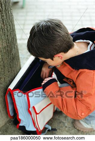 Child looking into backpack View Large Photo Image Stock Image - Child looking into backpack. Fotosearch