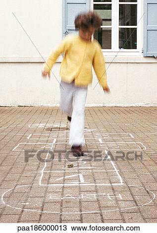 Child playing hopscotch View Large Photo Image Stock Image - Child playing hopscotch. Fotosearch