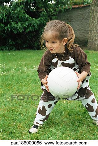 Stock Photograph - Child playing with soccer ball. Fotosearch