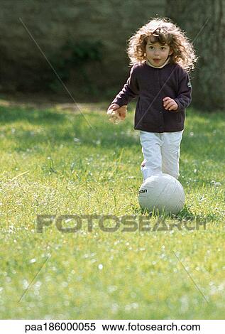 Child playing with soccer ball View Large Photo Image Stock Photography - Child playing with soccer ball. Fotosearch